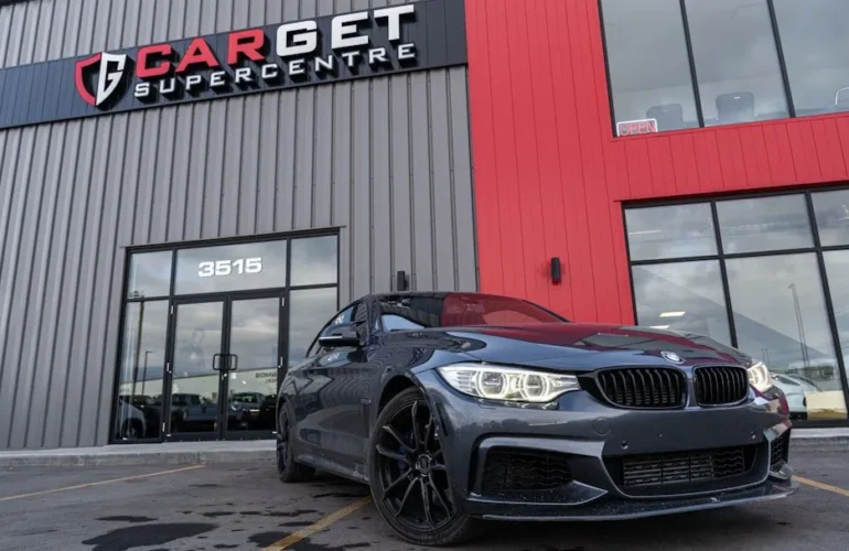 cash for cars vs private sale – a black car parked in front of a building