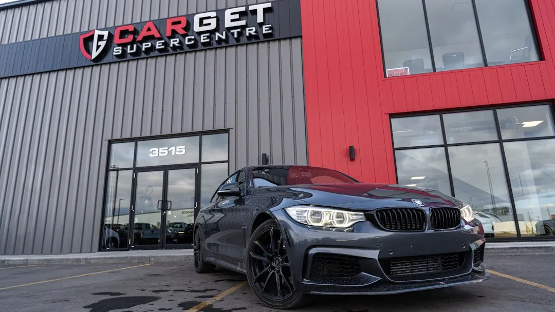 cash for cars vs private sale – a black car parked in front of a building